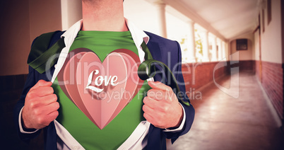 Composite image of businessman opening shirt in superhero style