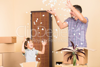 Father and his son playing indoors