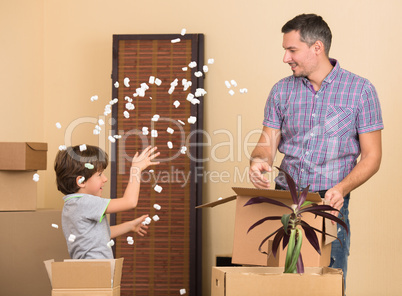 Father and his son playing indoors