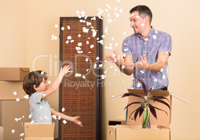 Father and his son playing indoors