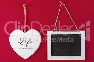 Love heart and emty blackboard on red