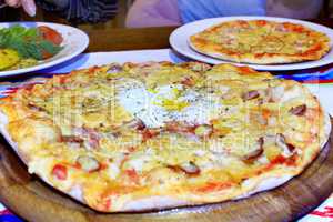 pizza with appetizing stuffing in pizzeria