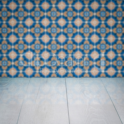 Wood table top and blur vintage ceramic tile pattern wall