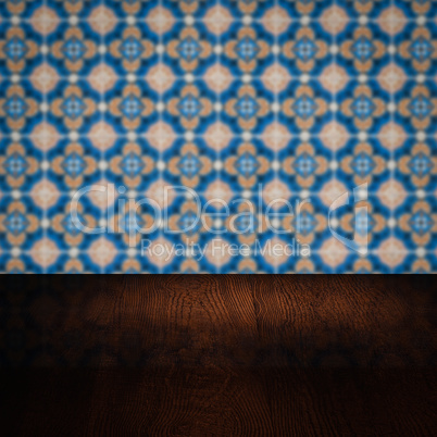 Wood table top and blur vintage ceramic tile pattern wall