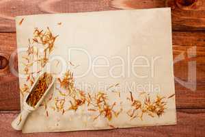 Saffron petals on an old piece of paper
