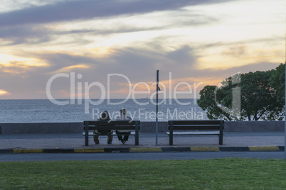 Couple Enjoying at Sunset Scene at Boardwalk in Montevideo