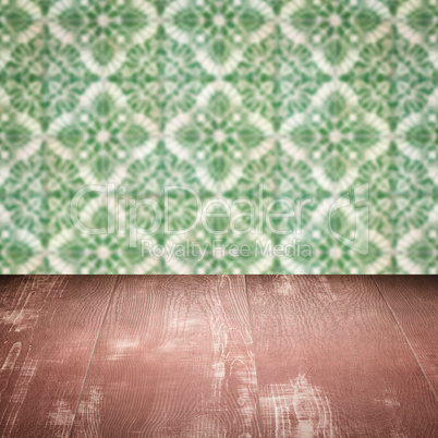 Wood table top and blur vintage ceramic tile pattern wall