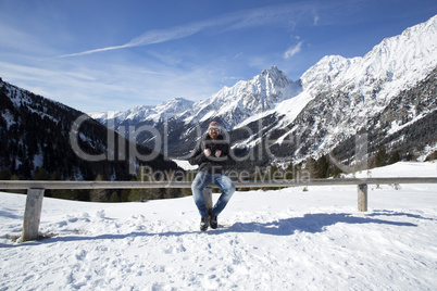 Young man enjoys winter landscape