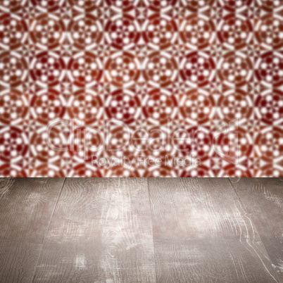 Wood table top and blur vintage ceramic tile pattern wall