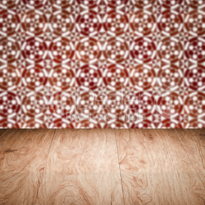 Wood table top and blur vintage ceramic tile pattern wall