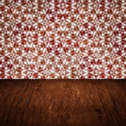 Wood table top and blur vintage ceramic tile pattern wall