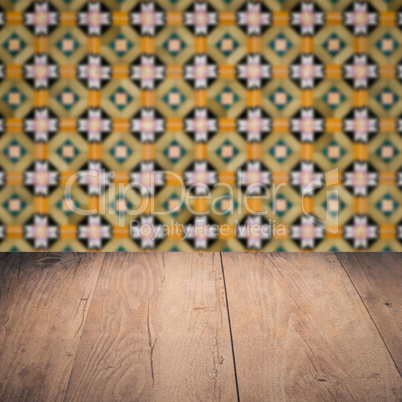 Wood table top and blur vintage ceramic tile pattern wall