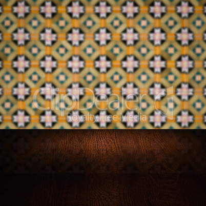 Wood table top and blur vintage ceramic tile pattern wall