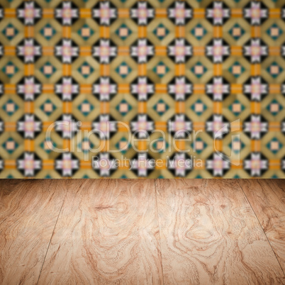 Wood table top and blur vintage ceramic tile pattern wall