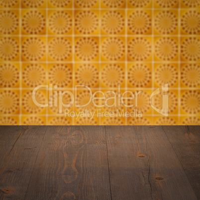 Wood table top and blur vintage ceramic tile pattern wall