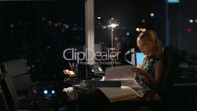 4 Businesswoman Working Late At Night Answering Phone Call