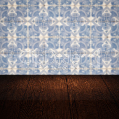 Wood table top and blur vintage ceramic tile pattern wall