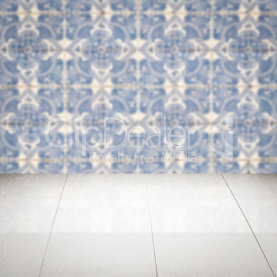 Wood table top and blur vintage ceramic tile pattern wall