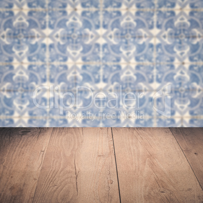 Wood table top and blur vintage ceramic tile pattern wall