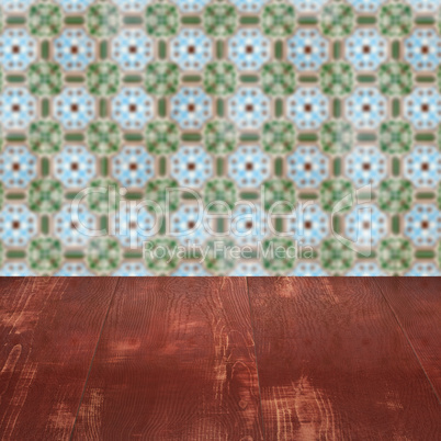 Wood table top and blur vintage ceramic tile pattern wall