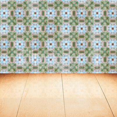 Wood table top and blur vintage ceramic tile pattern wall