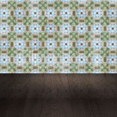 Wood table top and blur vintage ceramic tile pattern wall