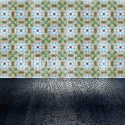 Wood table top and blur vintage ceramic tile pattern wall