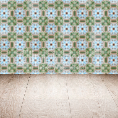 Wood table top and blur vintage ceramic tile pattern wall Wood table top and blur vintage ceramic tile pattern wall
