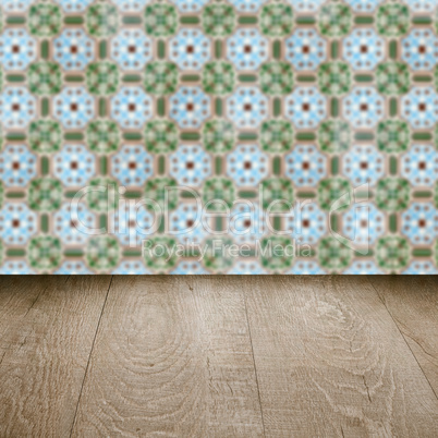 Wood table top and blur vintage ceramic tile pattern wall