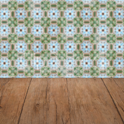 Wood table top and blur vintage ceramic tile pattern wall