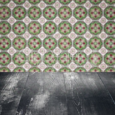 Wood table top and blur vintage ceramic tile pattern wall