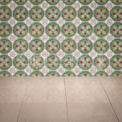 Wood table top and blur vintage ceramic tile pattern wall