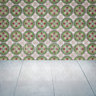 Wood table top and blur vintage ceramic tile pattern wall