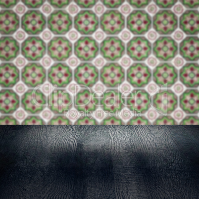 Wood table top and blur vintage ceramic tile pattern wall