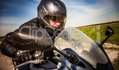 Biker racing on the road