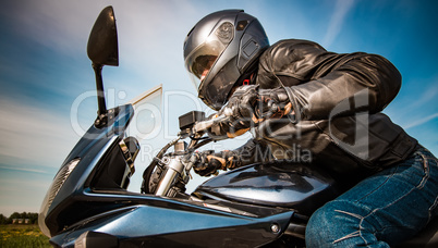 Biker racing on the road