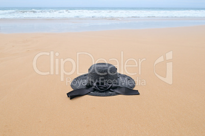 sun hat on the sandy beach