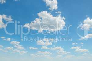 cumulus clouds in the blue sky