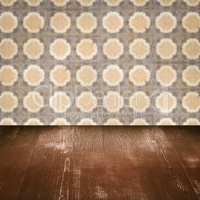 Wood table top and blur vintage ceramic tile pattern wall