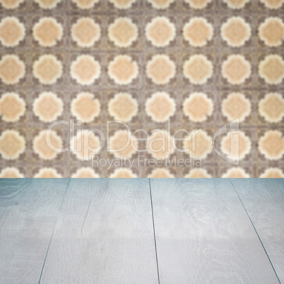 Wood table top and blur vintage ceramic tile pattern wall Wood table top and blur vintage ceramic tile pattern wall