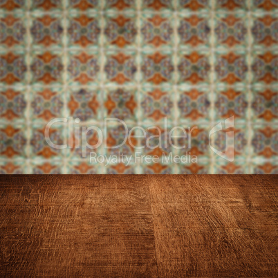 Wood table top and blur vintage ceramic tile pattern wall