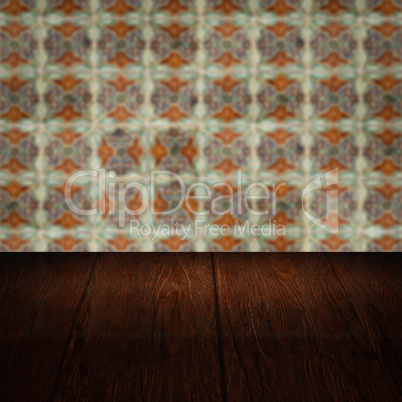 Wood table top and blur vintage ceramic tile pattern wall Wood table top and blur vintage ceramic tile pattern wall