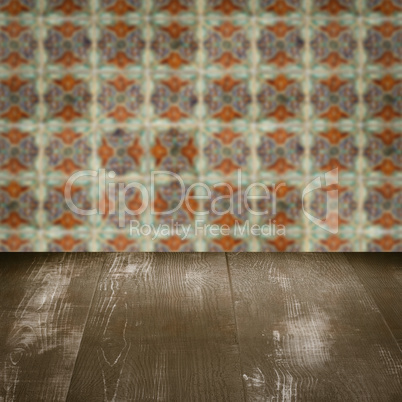 Wood table top and blur vintage ceramic tile pattern wall