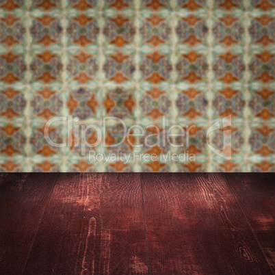 Wood table top and blur vintage ceramic tile pattern wall