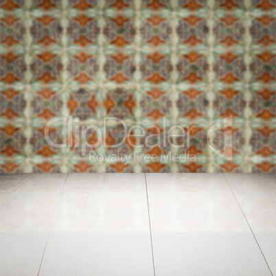 Wood table top and blur vintage ceramic tile pattern wall