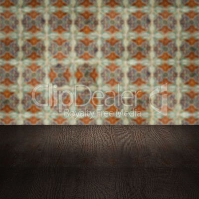 Wood table top and blur vintage ceramic tile pattern wall