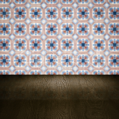 Wood table top and blur vintage ceramic tile pattern wall