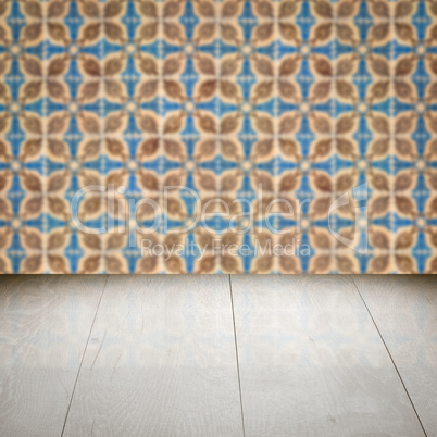 Wood table top and blur vintage ceramic tile pattern wall