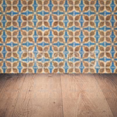 Wood table top and blur vintage ceramic tile pattern wall