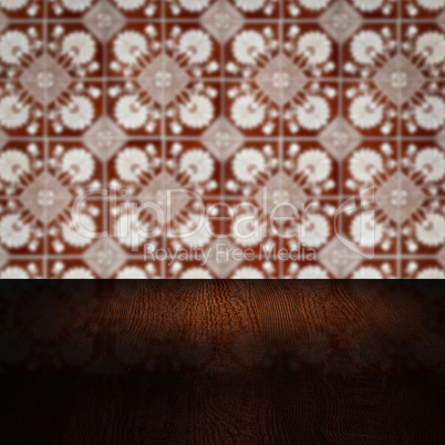 Wood table top and blur vintage ceramic tile pattern wall